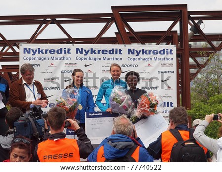 COPENHAGEN - MAY 21: The female winners of the yearly Copenhagen Marathon. First place, Anne-Sofie Hansen - Denmark, second, Tegla Chepkite Loroupe - Kenya, and third place, Mette Bogaard - Denmark on May 21, 2011.