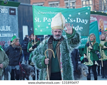 COPENHAGEN - MAR 17: Man acting as St. Patrick and other participants at the annual St. Patrick\'s Day celebration and parade in front of Copenhagen City Hall, Denmark on March 17, 2013.