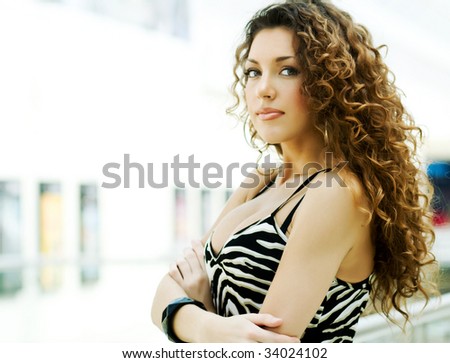Very sexy attractive woman with beautiful curly hair