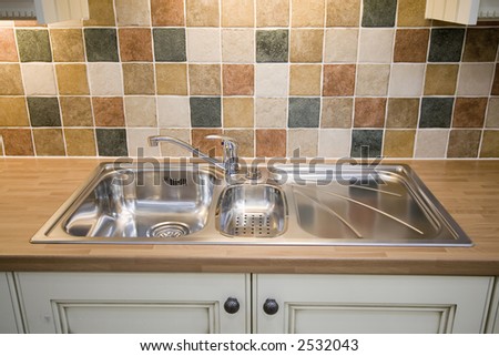 A stainless steel kitchen sink
