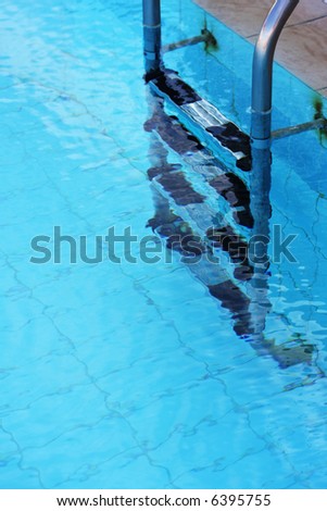 Close up of a clear swimming pool taken in vertical format.