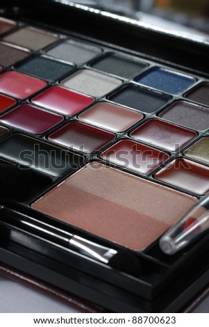 Close up shot of Makeup set. Selection of cosmetic colors.  Taken in vertical format.