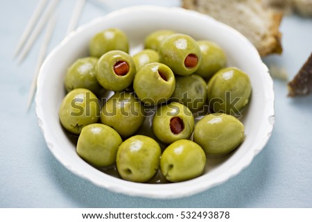 Green olives stuffed red peppers
