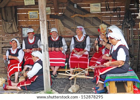 BRASHLYAN, BULGARIA - JULY 7: Old woman singing Bulgarian folk songs at Brashlyan on July 7, 2013 in Brashlyan