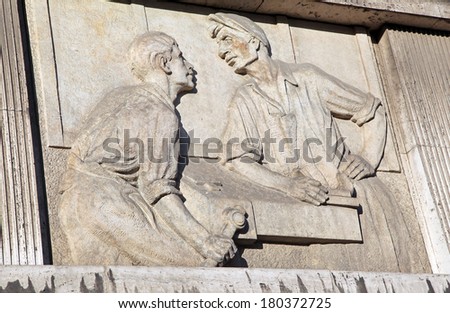 RUZOMBEROK, SLOVAKIA - MARCH 2: Old communist relief on the facade of the school building on March 2, 2014 in Ruzomberok