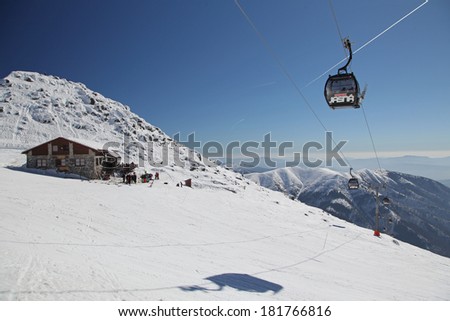 JASNA, SLOVAKIA - MARCH 13: Chalet on hill Chopok in ski resort Jasna - Low Tatras mountains on March 13, 2014 in Jasna