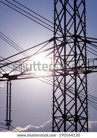 Power line pylon and sun