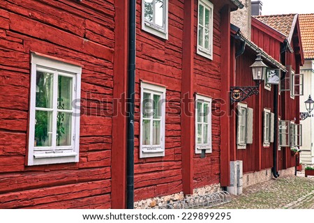 OREBRO, SWEDEN - AUGUST 3: Typical red houses in open air museum Wadkoping on August 3, 2012 in Orebro