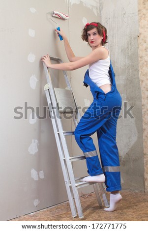 girl in the style of 50th climbs a ladder to paint the walls