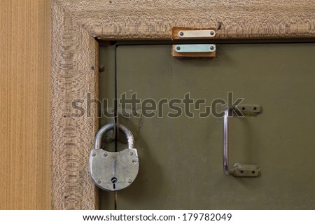 padlock on old door safe closeup