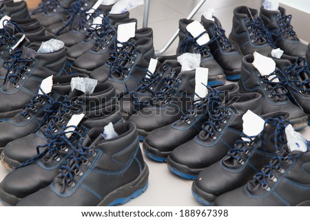 a lot of black work boots
