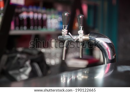two taps for draft beer at bar