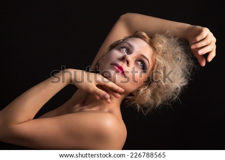 girl with two-faced makeup posing