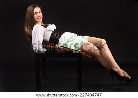 brunette in original air dress lying on the table