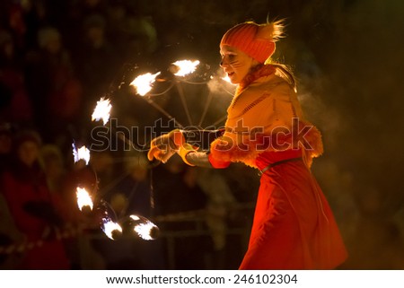 Perm, Russia - January 17, 2015. Young woman in  suit fox with fiery fan