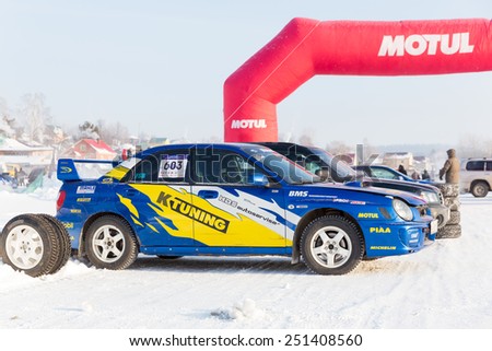 Dobryanka, Russia - February 7, 2015. Urban ice race. Sports car before the start of ice racing near red gate