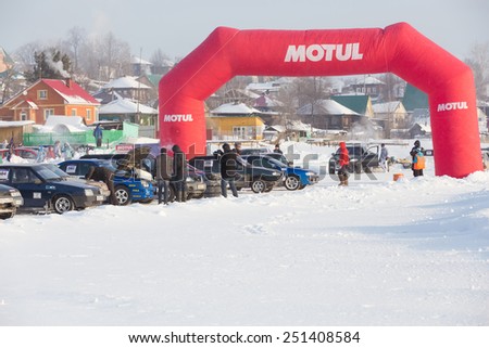 Dobryanka, Russia - February 7, 2015. Urban ice race. Red Gate and sports cars in winter
