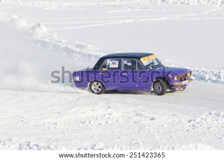 Dobryanka, Russia - February 7, 2015. Urban ice race. purple vaz-2107 on the road snow sports top view