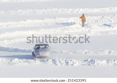 Dobryanka, Russia - February 7, 2015. Urban ice race. VAZ-2107 on the road snow sports top view