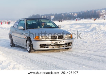 Dobryanka, Russia - February 7, 2015. Urban ice race. Sport BMW comes in turn to snow sports track closeup
