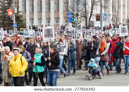Perm, Russia - May 9, 2015. The parade dedicated to the 70th anniversary of the victory in the Second World War. Men, women and children in the convoy at the parade \