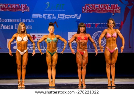 Perm, Russia - April 19, 2015.Cup Perm Krai  on bodybuilding and fitness bikini. Women in the category bodyfitness stand in the front position