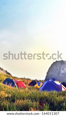 The tents in the mountains. Mountain landscape.