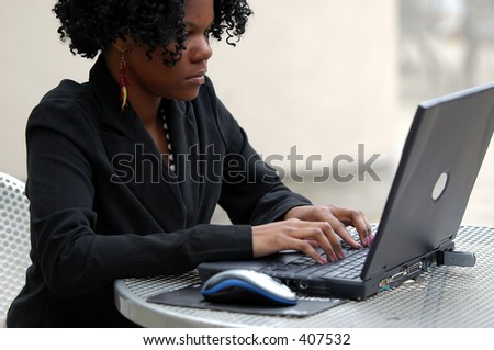 Young lady typing on the computer