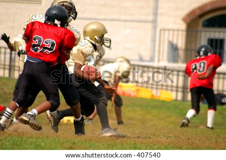 African American youth playing football