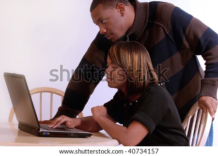 African-American couple searching on the computer together
