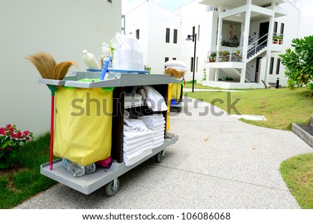 The hotel cleaning tool cart of housekeeper are on the walkway of resort area