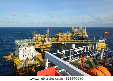 The  large offshore oil rig drilling platform is in the gulf of Thailand.