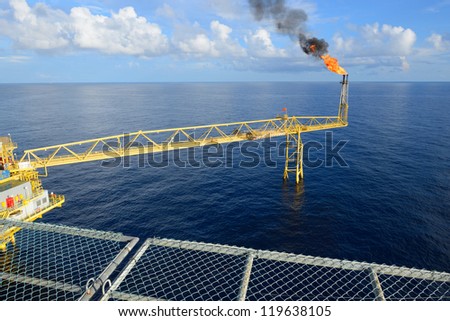 The gas flare is on the oil rig platform.