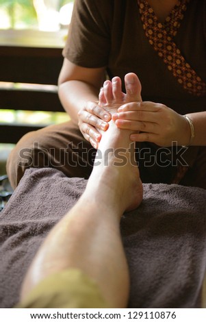 The women massage his foot for thai spa foot massage