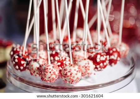 funny sweet round candy on a stick with powder for dessert bar table decoration decor