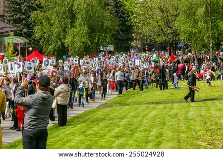 Pyatigorsk, Russia - May 9, 2014: Festive demonstration dedicated to the to Victory Day. Pyatigorsk. People with portraits of relatives who had fought are on the streets.