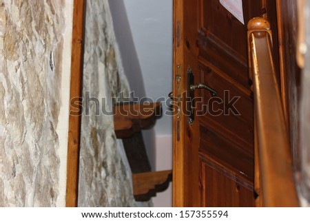 wooden door at top of stairs
