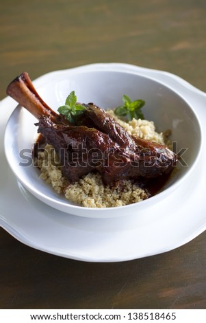 Indian spiced, braised lamb shank over cous cous.
