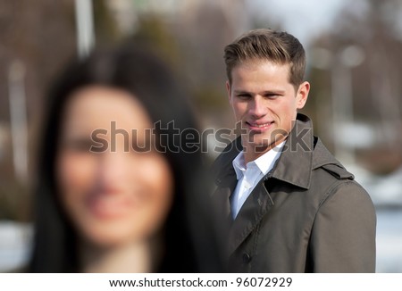 Young man flirting on the street - stock photo