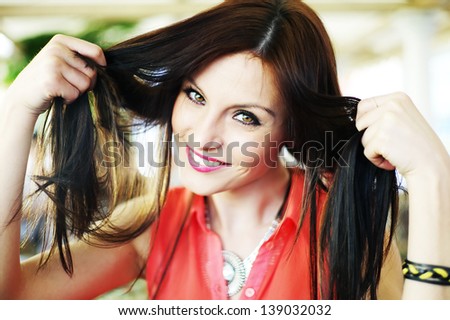 Portrait of a young brunette girl - worries about hair problems