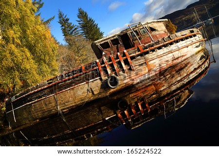 Wreck boat on the shore of Lochness, Scotland, Europe