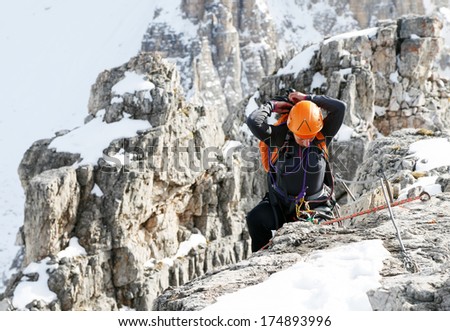 Alpinist climbing ferrata La torre di Toblin (2.617 m), Dolomites, Italy, Europe