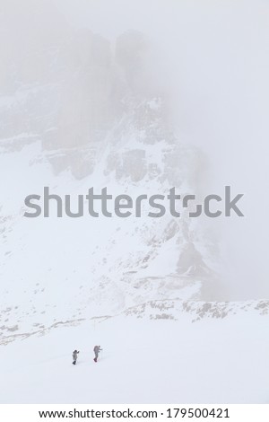 Winter trekking in the Dolomites, Sella Group, Italy, Europe - foggy conditions