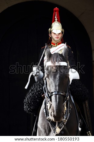 LONDON, UNITED KINGDOM - OCTOBER 14 2013 : Guard on horse at Buckingham Palace in London, England