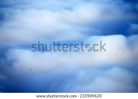 Paragliding over a sea of clouds, El Teide National Park, Spain, Europe