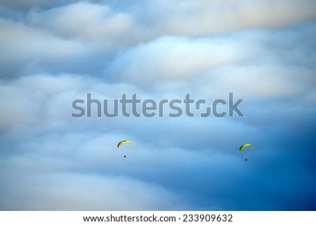 Paragliding over a sea of clouds, El Teide National Park, Spain, Europe