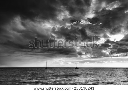 Boat on the Atlantic Ocean - stormy clouds in the background
