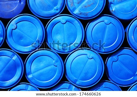 Blue plastic barrels containing chemicals