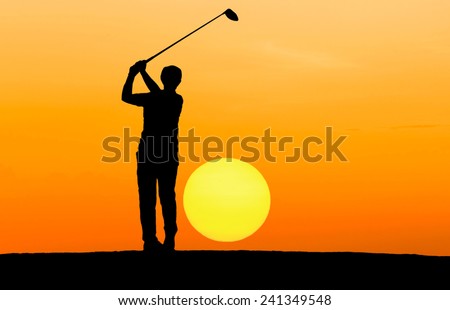 silhouette golfer hitting golf ball on sunset