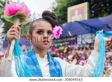 UBONRATCHATHANI, THAILAND - JULY 31 : Unidentified dancers perform traditional Thai dance at traditional candle procession festival of Buddha on july 31,2015  at Ubonratchathani, Thailand.
